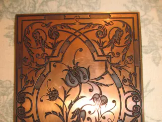 Une plaque de dorure signée Marius Michel
