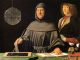 Le frère Luca Pacioli, en habit franciscain, penché sur un livre ouvert et un compas, à côté d'un jeune homme